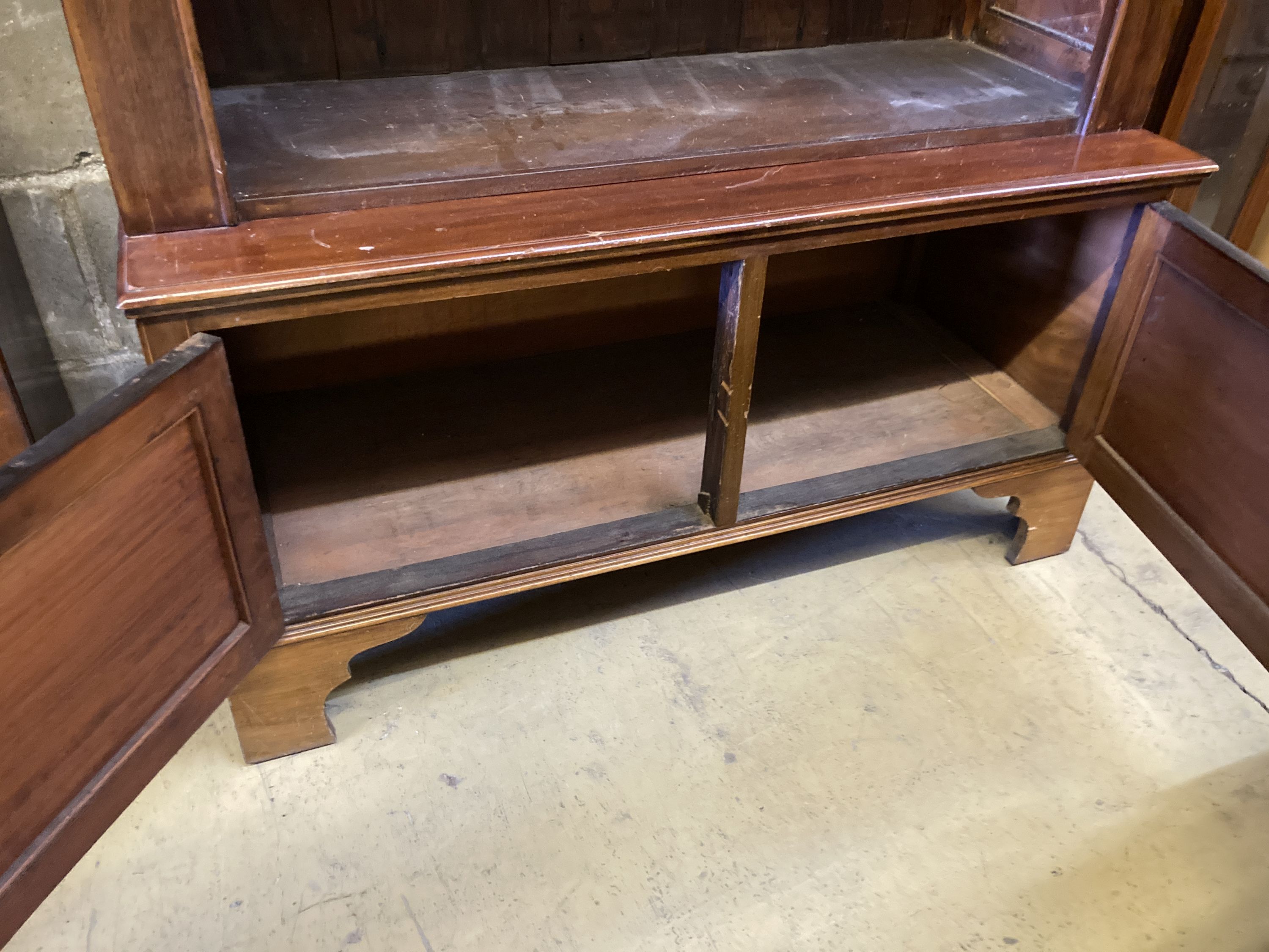 A mahogany open bookcase cupboard, length 110cm, depth 46cm, height 198cm